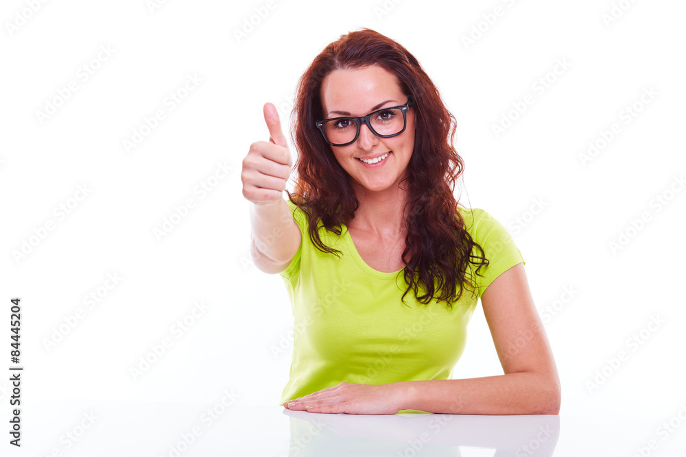 Smiling young woman gesturing thumb up Smiling young woman gesturing thumb up