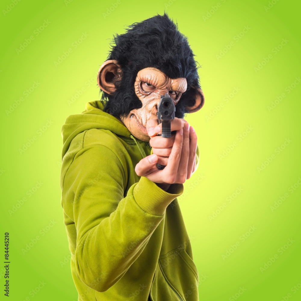 Monkey man shooting with a pistol Monkey man shooting with a pistol