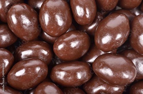Dark brown dragee, chocolate covered nuts