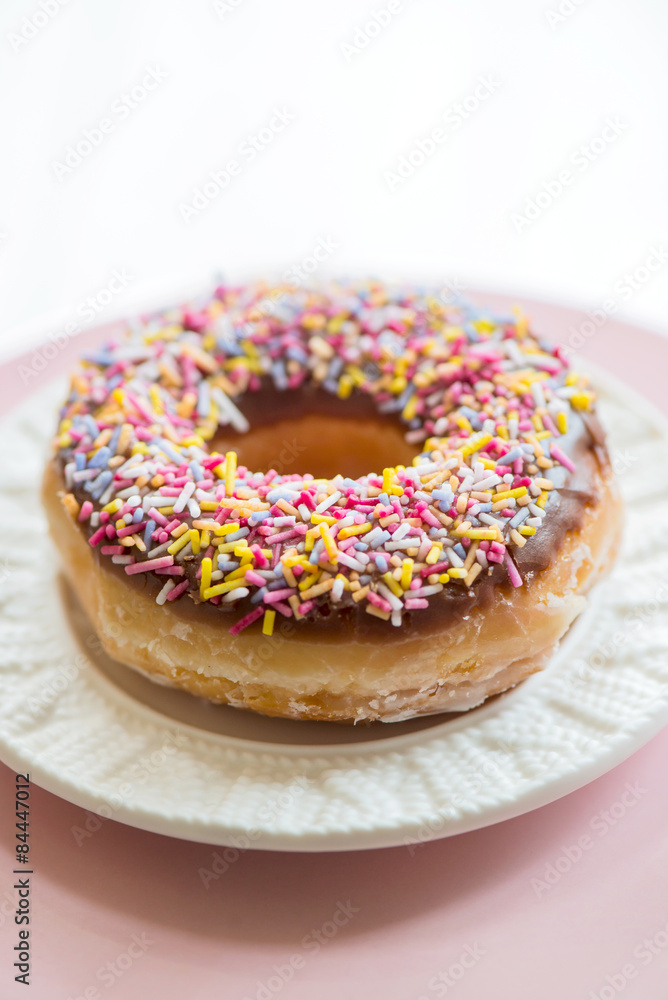 Glazed Doughnut with colourful sprinkles Glazed Doughnut with colourful sprinkles
