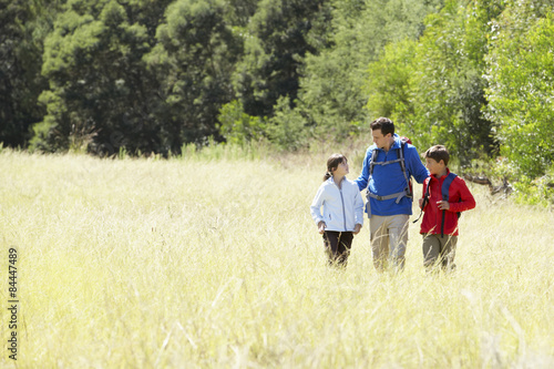 Father With Children On Hike In Beautiful Countryside