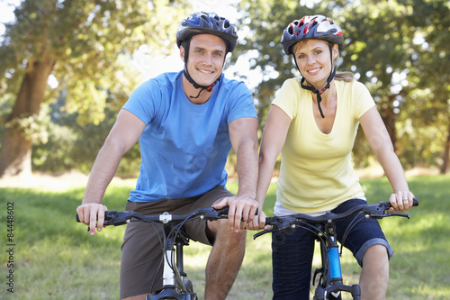 Fototapeta Naklejka Na Ścianę i Meble -  Couple On Cycle Ride In Countryside