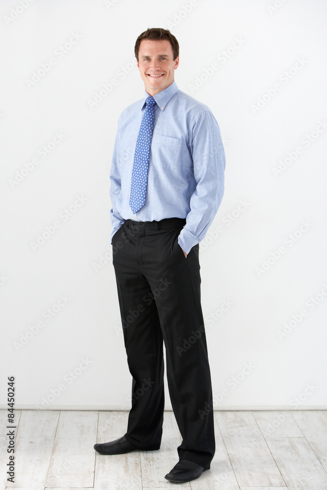 Studio Portrait Of Businessman Standing Against White Background Studio Portrait Of Businessman Standing Against White Background