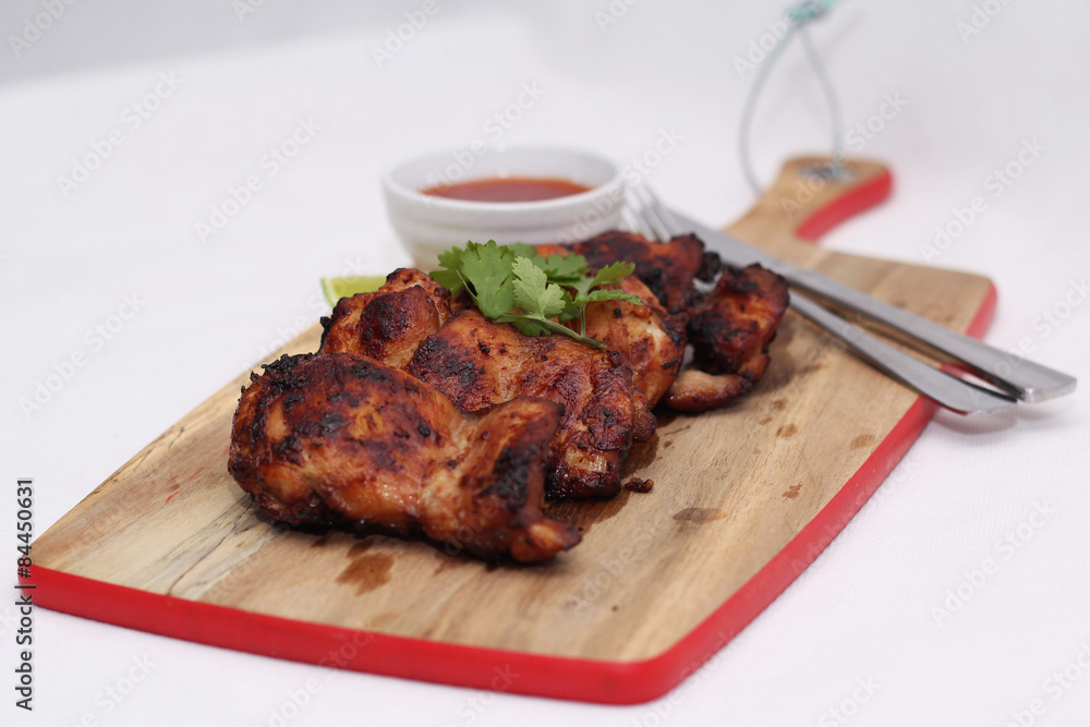Grilled spicy chicken thighs with lime and sweet chilli sauce Grilled spicy chicken thighs with lime and sweet chilli sauce