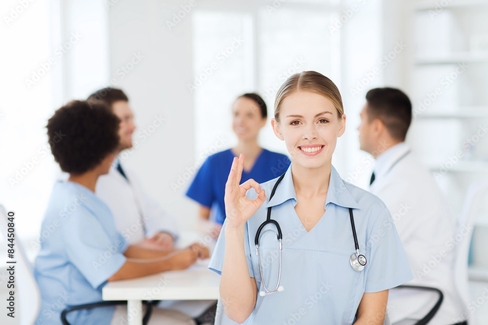happy doctor over group of medics at hospital happy doctor over group of medics at hospital