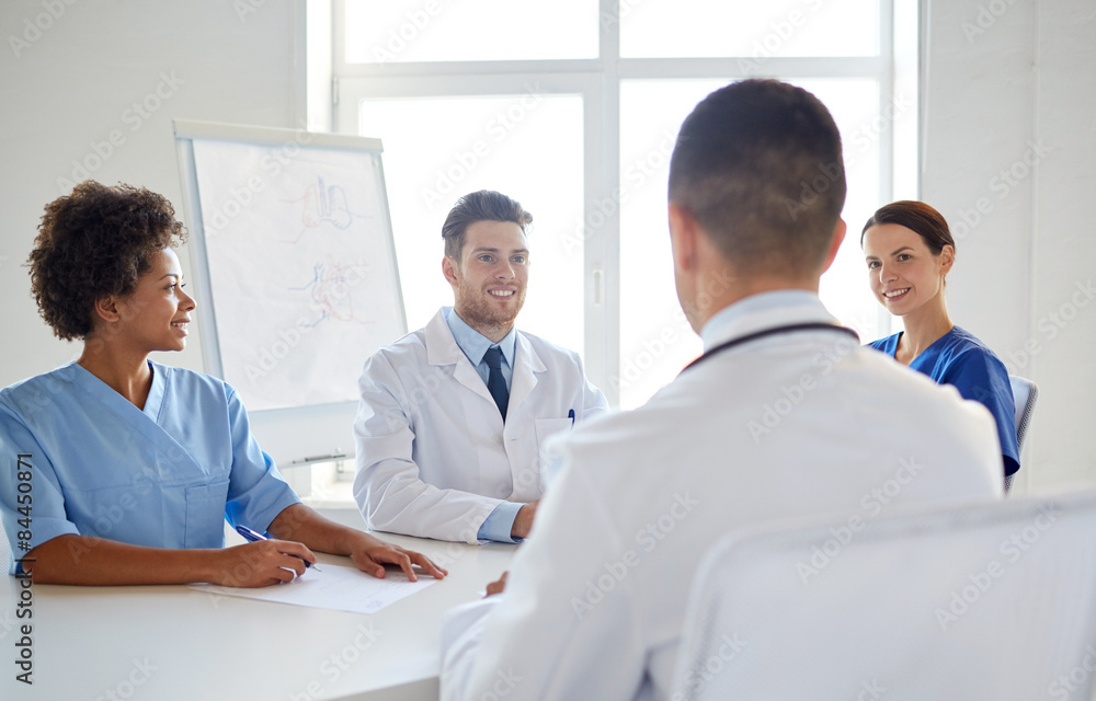 group of happy doctors meeting at hospital office group of happy doctors meeting at hospital office