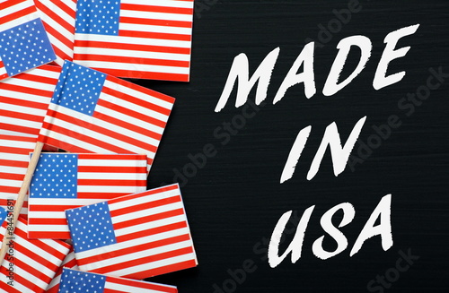The phrase Made In USA with flags on a blackboard