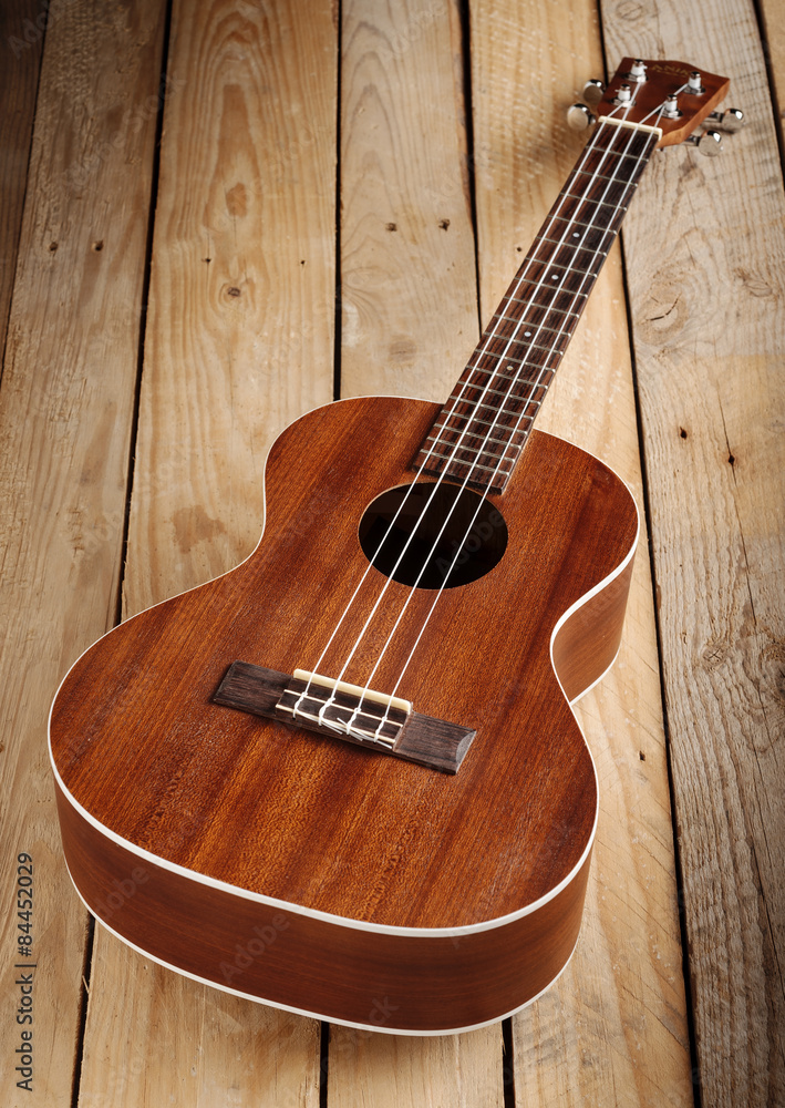 hawaiian ukulele on wooden floor hawaiian ukulele on wooden floor