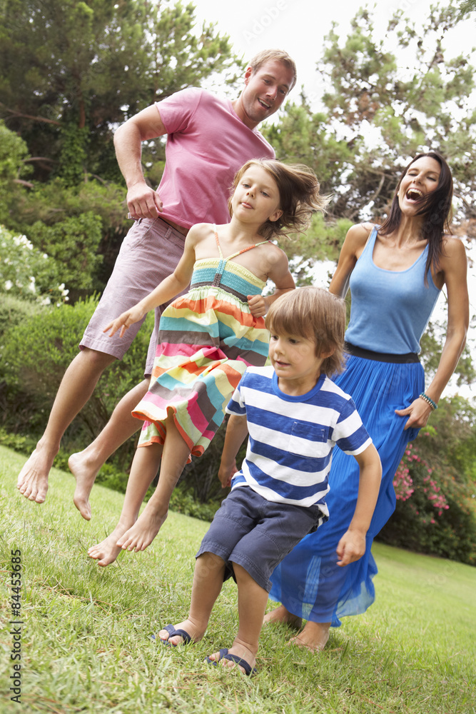 Fototapeta premium Family Playing In CountrysideTogether