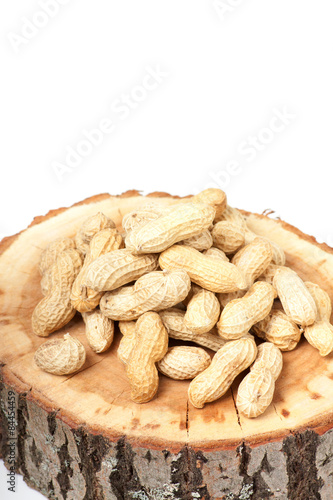 Pile of unshelled peanuts, isolated on white background