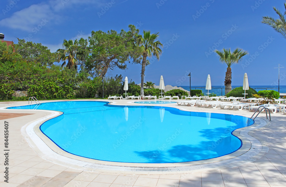 Swimming pool area near Mediterranean Sea in Antalya, Turkey