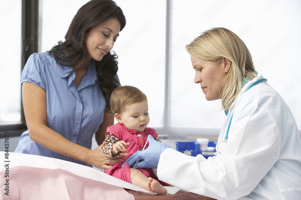 Doctor In Surgery Giving Baby Girl Injection Doctor In Surgery Giving Baby Girl Injection