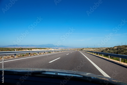 Highway through spanish countryside seen from passengers seat