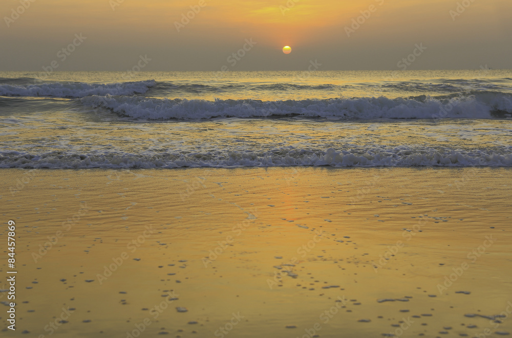 Beautiful sunrise on the golden beach in Thailand