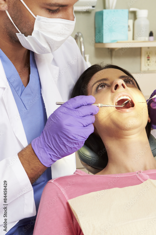 Woman Having Check Up At Dentists Surgery Woman Having Check Up At Dentists Surgery