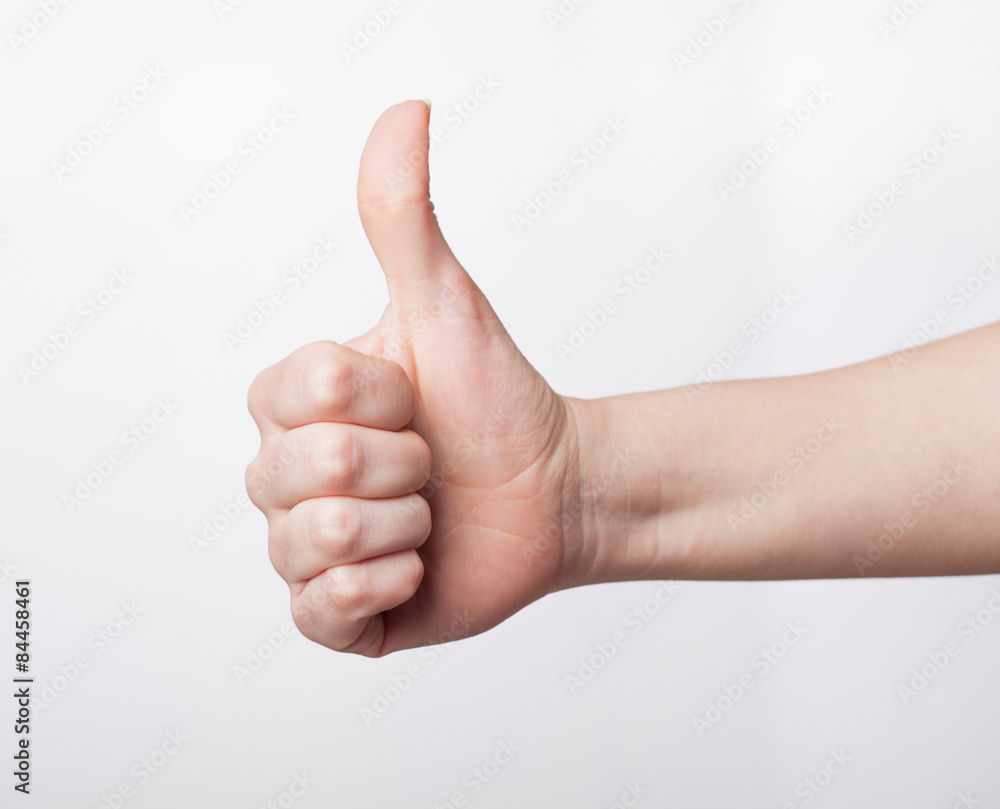 Approval thumbs up like sign as hand gesture isolated over whit Approval thumbs up like sign as hand gesture isolated over whit