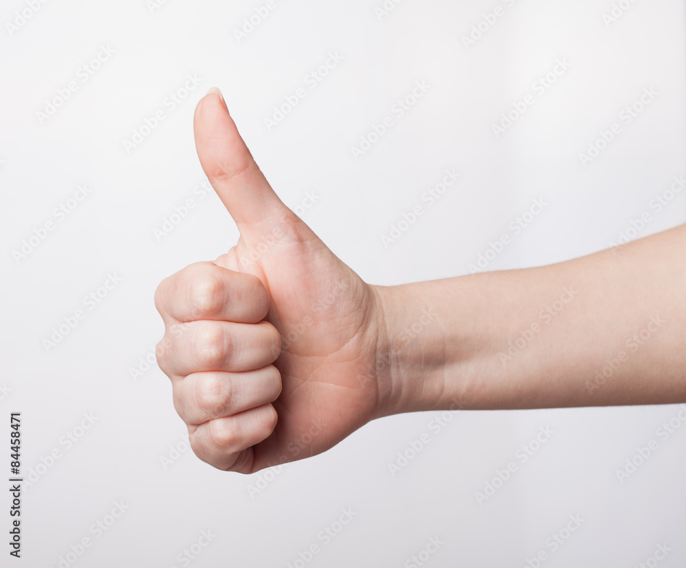 Approval thumbs up like sign as hand gesture isolated over whit Approval thumbs up like sign as hand gesture isolated over whit