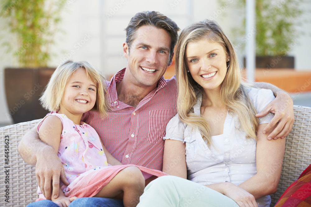 Naklejka premium Family Sitting On Garden Seat Together