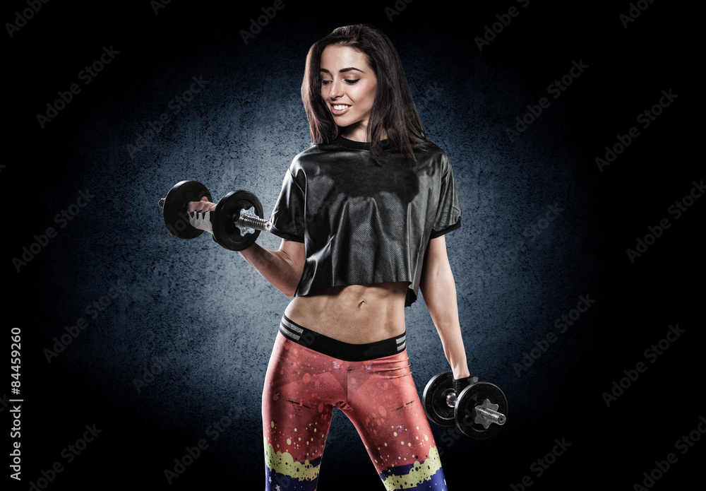 Sports young woman with dumbbells Sports young woman with dumbbells