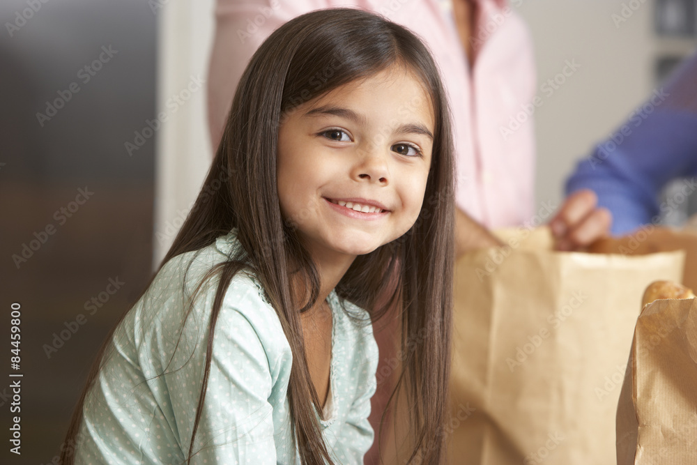 Family Unpacking Grocery Shopping In Kitchen Family Unpacking Grocery Shopping In Kitchen