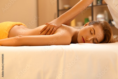 Spa Massage. Beautiful Blonde Gets Spa Treatment in Salon.