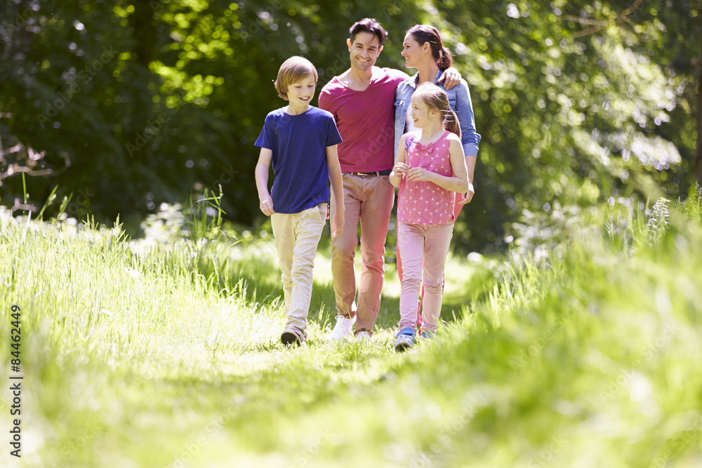 Family Walking Through Summer Countryside Family Walking Through Summer Countryside