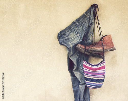 Vintage,Jeans,Leather shoes and bag hanging on the wall