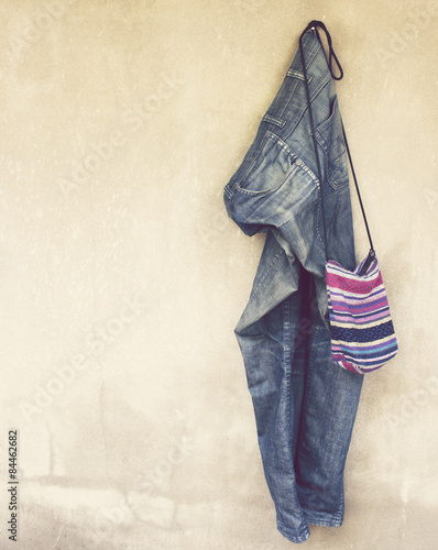 Vintage,Jeans and Shoulder Bag hanging on the wall