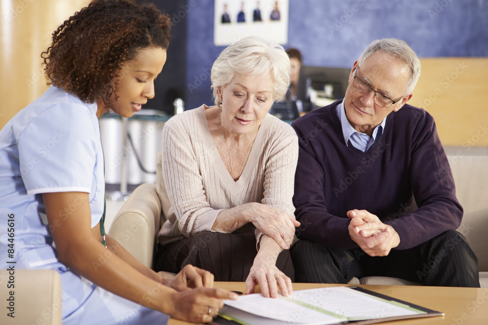 Senior Couple Meeting With Nurse In Hospital Senior Couple Meeting With Nurse In Hospital