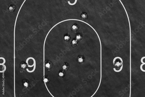 Paper target in successful bullet holes