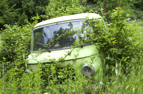 Old abandoned overgrown car