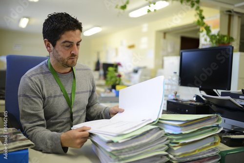 Office worker reading files at office