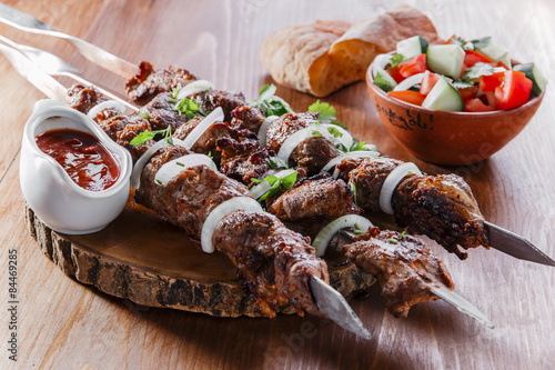 Konstfotografi skewers shashlik kebab  with red sauce