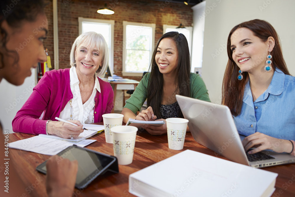 Group Of Businesswomen Meeting To Discuss Ideas Group Of Businesswomen Meeting To Discuss Ideas
