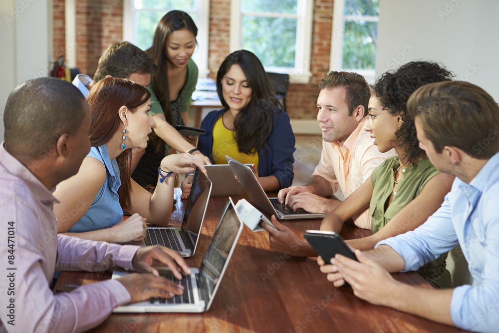 Businessmen And Businesswomen Meeting To Discuss Ideas Businessmen And Businesswomen Meeting To Discuss Ideas
