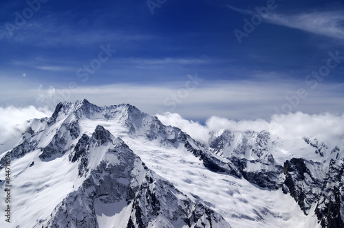 Snowy mountains in clouds