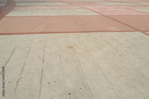 white and pink pavement, curved lines
