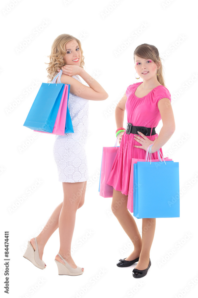 two girls in dresses after shopping isolated on white