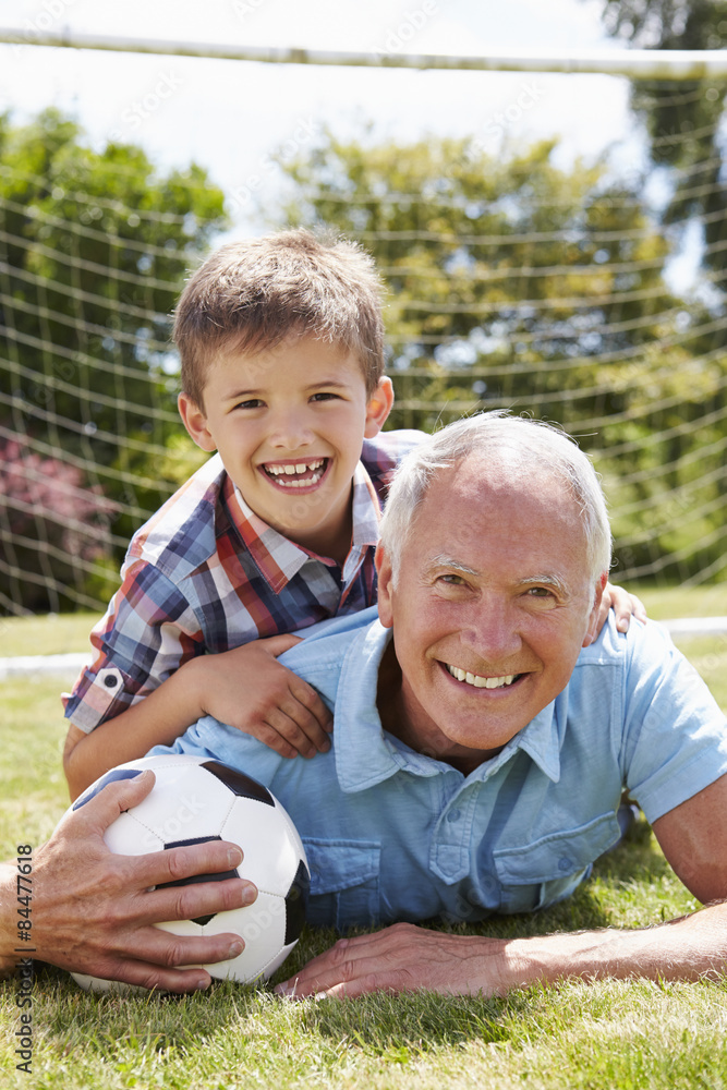 Portrait Of Grandfather And Grandson With Football Portrait Of Grandfather And Grandson With Football