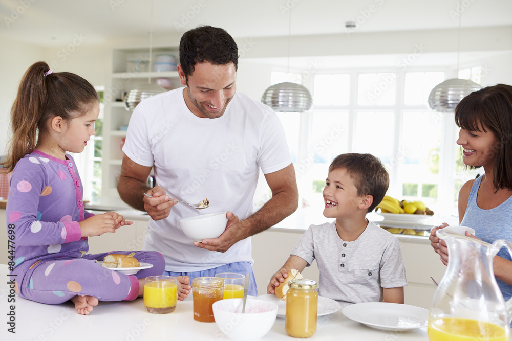 Family Eating Breakfast In Kitchen Together Family Eating Breakfast In Kitchen Together