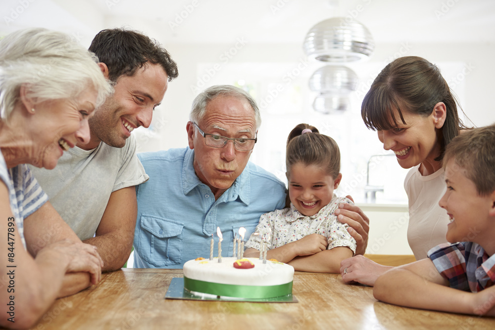 Multi Generation Family Celebrating Grandfather's Birthday