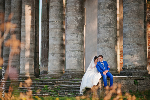 Young wedding couple on background old castle © AS Photo Family
