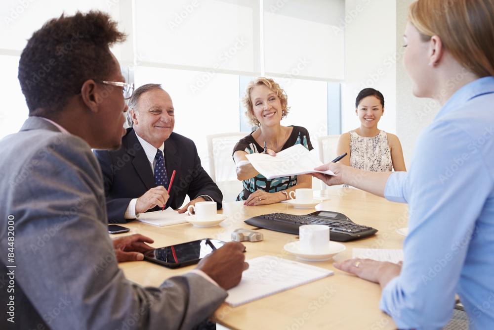 Five Businesspeople Having Meeting In Boardroom Five Businesspeople Having Meeting In Boardroom