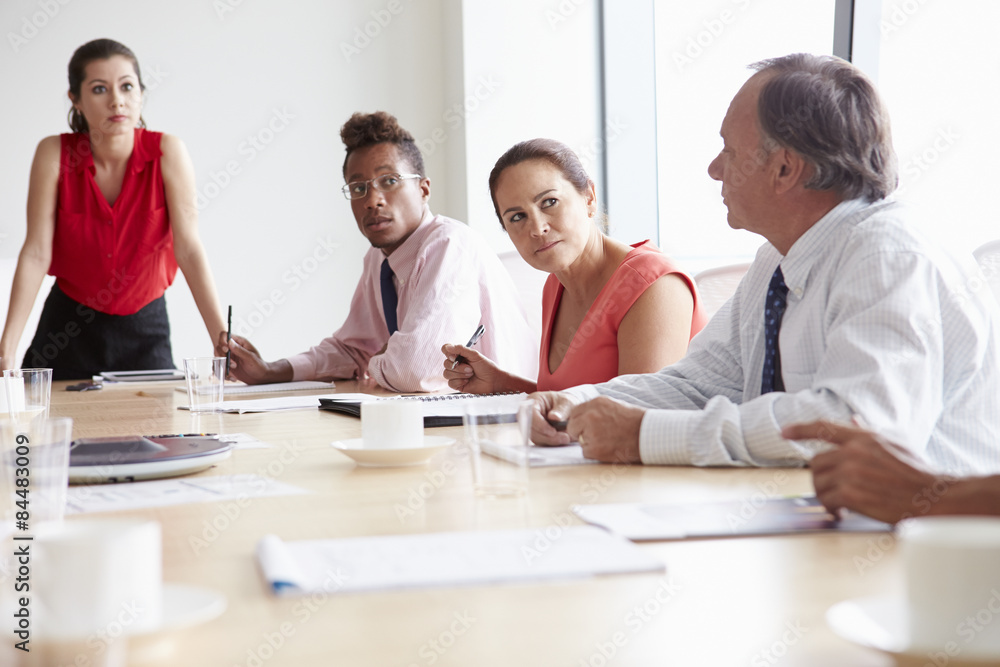 Group Of Businesspeople Meeting Around Boardroom Table Group Of Businesspeople Meeting Around Boardroom Table