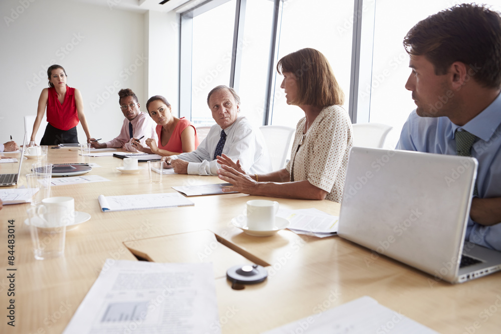 Group Of Businesspeople Meeting Around Boardroom Table Group Of Businesspeople Meeting Around Boardroom Table