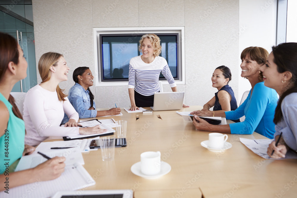 Group Of Businesswomen Meeting Around Boardroom Table Group Of Businesswomen Meeting Around Boardroom Table
