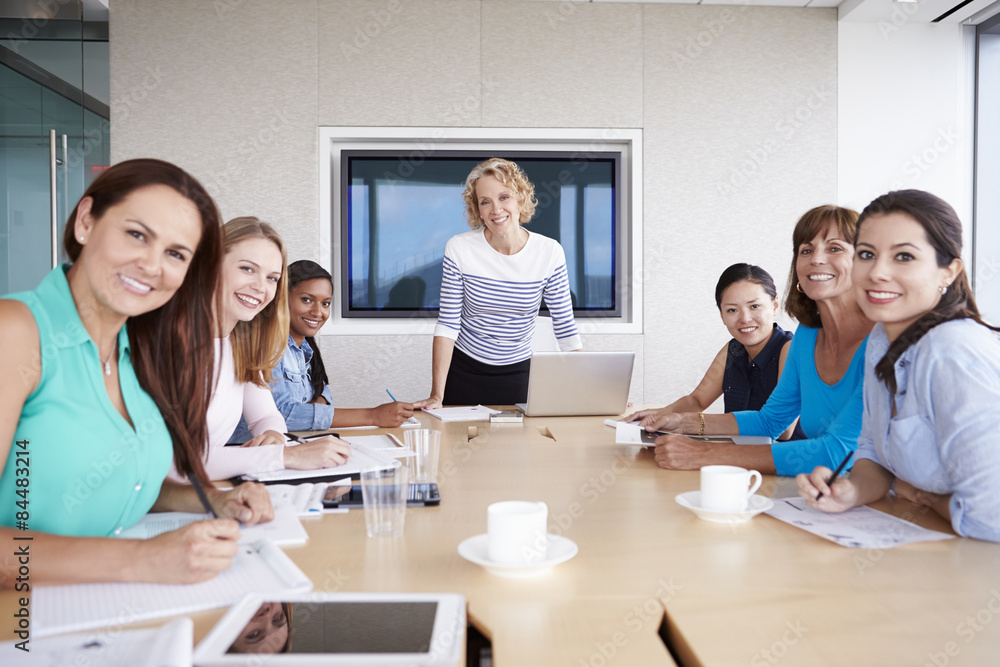 Group Of Businesswomen Meeting Around Boardroom Table Group Of Businesswomen Meeting Around Boardroom Table