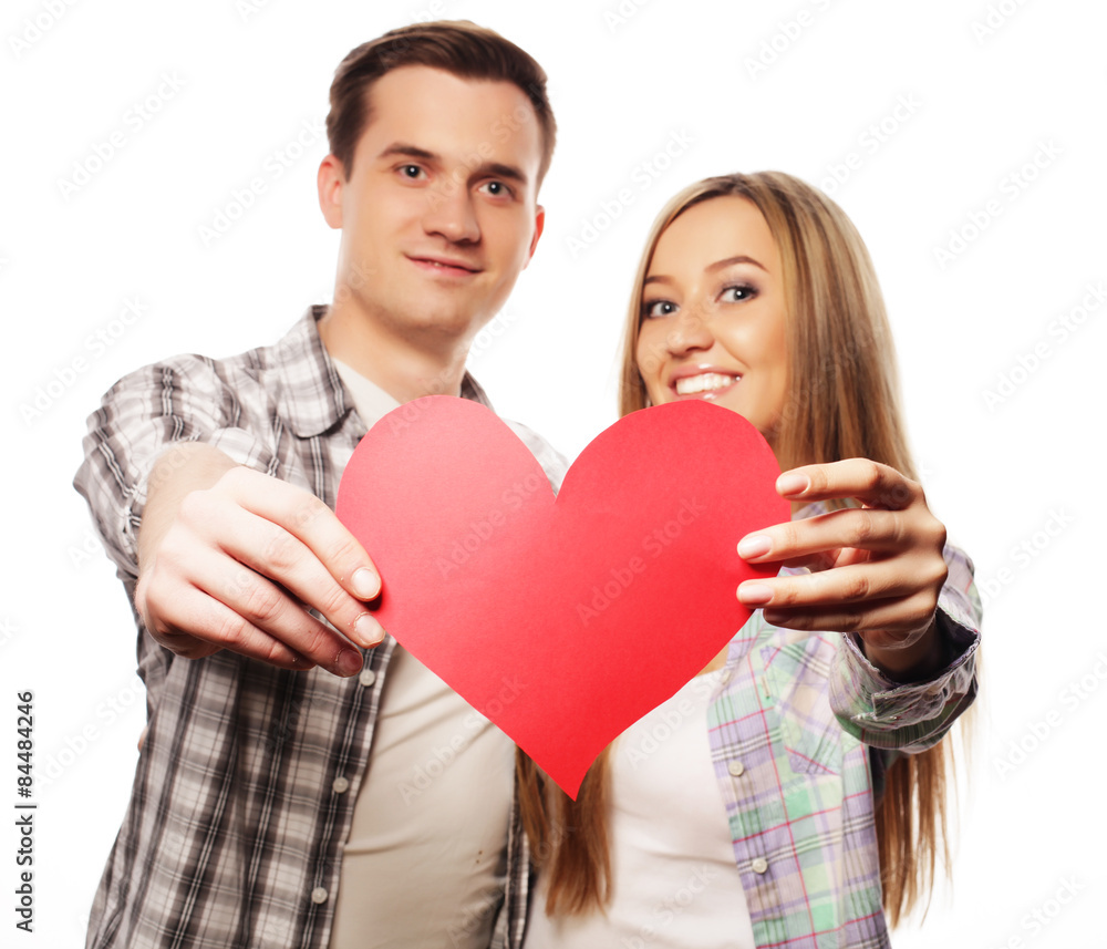 Happy couple in love holding red heart