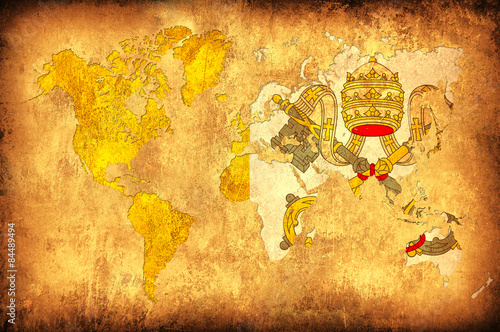 The flag of Vatican in the outline of the world map