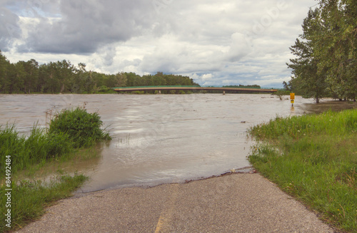 A pathway flooded by the water of the Bow River at Fish Creek Park during the 2013 Calgary Flood.